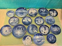 Front view of 19 blue and white Danish Christmas plates