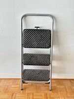 Front view folded ladder showing three steps and Cosco branding