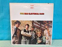 Front album cover featuring band photo and title