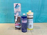 Front view showing boxed X10 filter, Spa Clear bottle, Cartridge Cleaner bottle