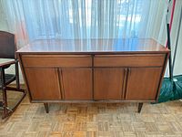 Front view of walnut sideboard
