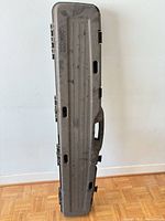 Full front view of closed hard case showing handle and latch positions