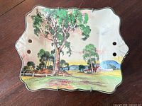 Front of Royal Doulton rectangular dish showing pastoral scene and scalloped edge