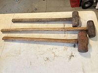 Three sledgehammers full length