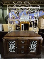 Full view of assembled buffet hutch showing wood base and metal scroll hutch top