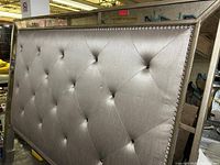 Full view of silver champagne tufted king headboard