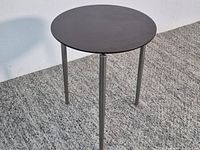 Full view of round table standing upright