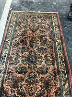 Full view of Persian rug showing entire field and borders