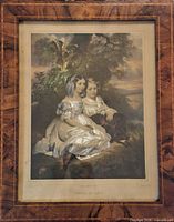 Full view of framed print showing image and title matting