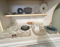 Full view of shelves with assorted ashtrays