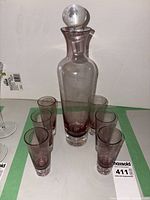 Full decanter with stopper and six tumblers