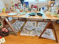 Full view plywood tabletop on two sawhorses, items around not included