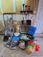 Wide shot of all tools, chemicals, gravel bags, jerry cans and accessories