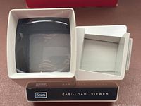 Front view of slide viewer showing screen and side loader