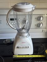 Front view of assembled SunBeam blender on stovetop