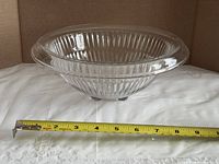 Top angled view showing full bowl and tape measure indicating diameter