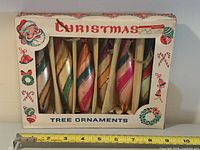 Boxed set front view showing six ornaments and graphics