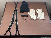 Full set laid out: suspenders, cummerbund, gloves, bow tie, cufflinks, studs