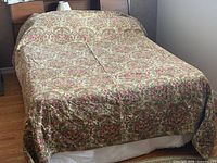 Bedspread displayed on double bed, full view