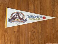 Full view of triangular pennant showing graphics and dimensions