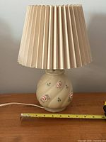 Full view of lamp with shade and tape measure for scale