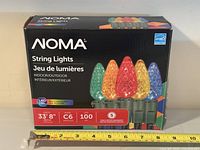 Retail box front showing Noma branding and product details