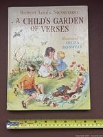 Front cover showing title, author, illustrator, ruler for scale