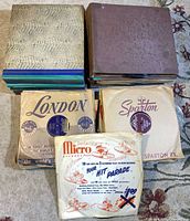 Stack of record albums and sleeved singles showing labels London, Sparton, Micro