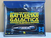 Front view of pouch showing title card through clear front