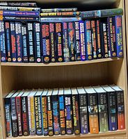 Full view of two shelves showing entire collection of David Weber books