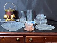 Group view of ice bucket, snifters, various bowls, vases, plates