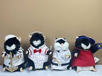 Front view of all four Gemmy hamsters in respective costumes