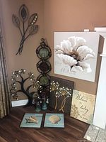 Group shot showing all wall art pieces and candle holders