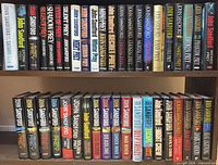 Full view of both shelves showing entire 40-book collection