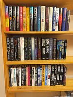 Three shelves filled with Koontz hardcovers showing quantity and variety