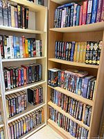 Full view of two bookcases loaded with hardcovers and paperbacks