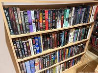 Entire three-shelf bookcase filled with hardcovers