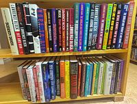 Top shelf of hardcovers showing Lawrence Block set and other thrillers