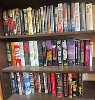 Three shelf rows filled with Stephen King and other horror/fantasy books