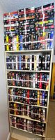 Full bookcase filled with VHS tapes on five levels
