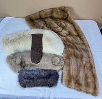 Group shot of all fur pieces and gloves laid out