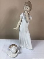 Yawning Girl and Seraph’s Head figurines together