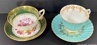 Both teacup and saucer sets side by side