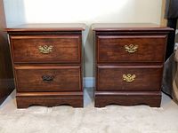 Front view of both nightstands showing drawer configuration and hardware