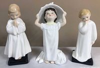 Front view of all three Royal Doulton figurines