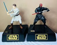 Both Obi-Wan Kenobi and Darth Maul interactive talking banks on bases