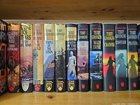 Spines of all 11 Terry Goodkind hardcovers on shelf