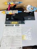 Full view of alarm clock with podracer, manual and decal sheet