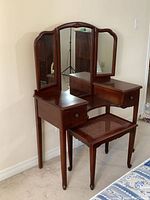 Full view of vanity with mirror and bench