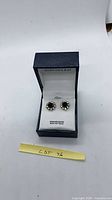 Earrings displayed in Hudson's Bay box, front view